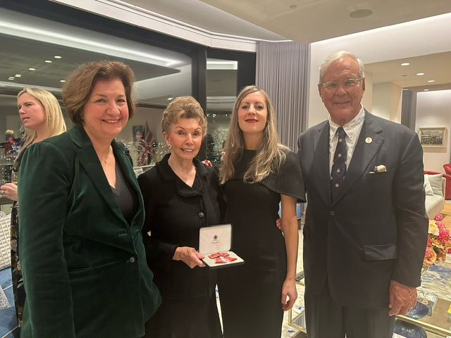 MBE MEDAL awarded to Natalie Pray by British Consul General on behalf of The King Karen Karpowich, National President, ESU - on left; Natalie Pray, MBE; Hannah Young, British Consul General; Charles Poekel, President, ESU, Palm Beach - on right